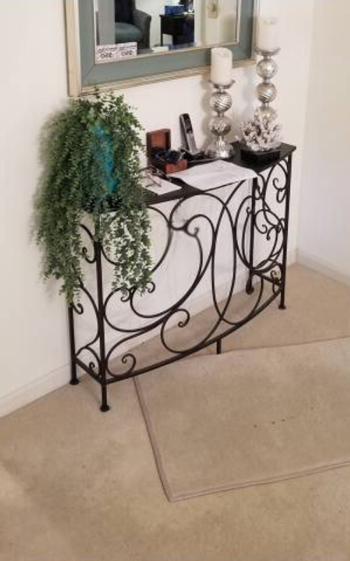 Entryway with old carpet before renovation